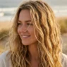 Woman with natural beach hair texture showing sun-kissed highlights and ocean breeze movement