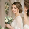 Bride with elegant chignon updo hairstyle in professional studio portrait