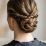 Close-up of elegant updo at nape showing bobby pin placement and twisted hair sections