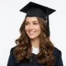 Woman with elegant graduation hairstyle wearing cap showing flowing hair styling