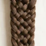 Close-up detail of intricate braid showing individual hair strands and crossover weaving pattern