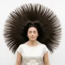 Long hair fanned out in perfect symmetrical circle on white background showing natural texture