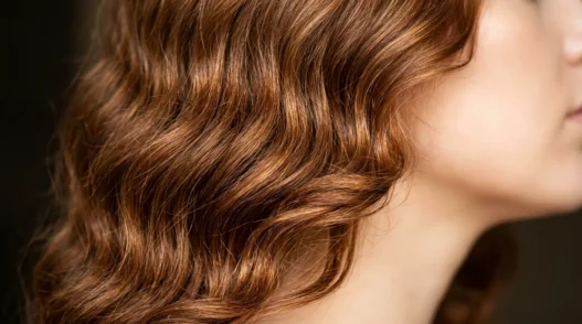 Woman with medium length hair showing natural waves and realistic texture from jawline to crown