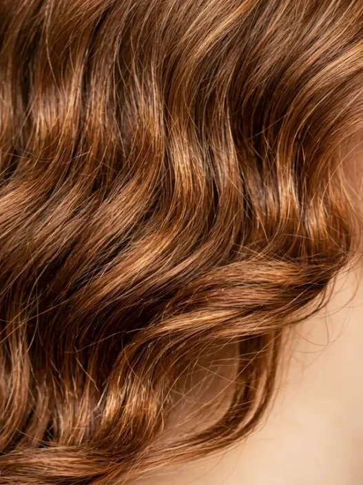 Woman with medium length hair showing natural waves and realistic texture from jawline to crown