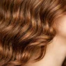 Woman with medium length hair showing natural waves and realistic texture from jawline to crown