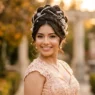 Young woman in formal dress with elaborate pearl and jewel hair accessories in elegant updo