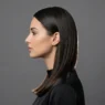 Woman with sleek straight hair showing smooth texture in professional studio lighting