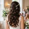 Brunette woman from behind showing elegant bridal half up half down hairstyle with romantic curls