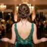 Woman from behind showing sophisticated updo hairstyle on medium length hair in evening setting