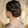Close-up view of elegant updo at nape of neck showing intricate pin placement and twisted hair sections