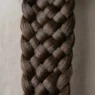 Close-up detail of intricate braid pattern showing individual hair strands and crossover technique