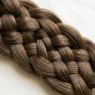 Close-up of intricate braid showing detailed weave pattern and crossover technique with visible individual strands