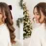 Woman with long brown hair in Christmas half up half down with soft curls and velvet bow